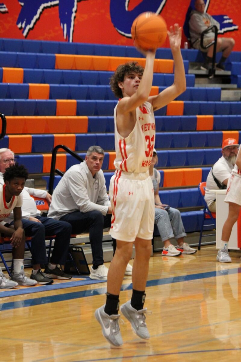 Basketball player going up for a shot